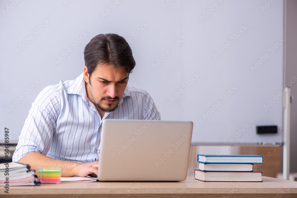 Young male teacher in telestudying concept Young male teacher in telestudying concept