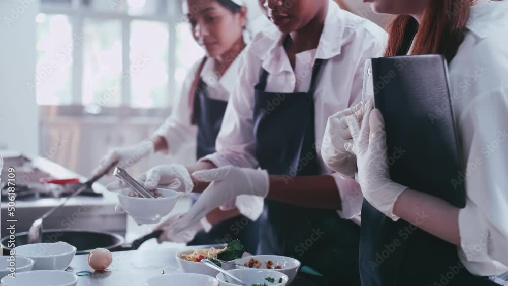 Group of schoolgirls having fun learning to cook. Female students in a cooking class. Group of schoolgirls having fun learning to cook. Female students in a cooking class.