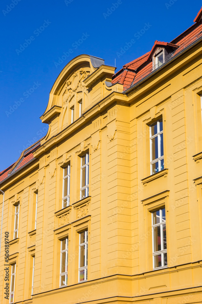 Yellow facade of a historic school building in Magdeburg, Germany