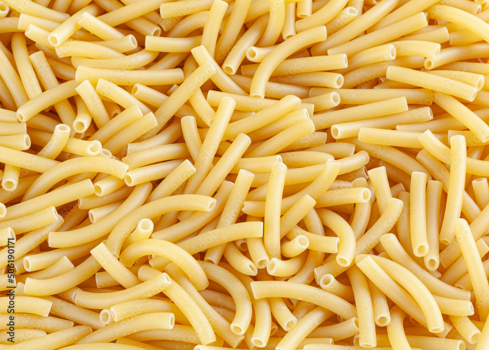 Background witn raw italian maccheroni pasta Background witn raw italian maccheroni pasta