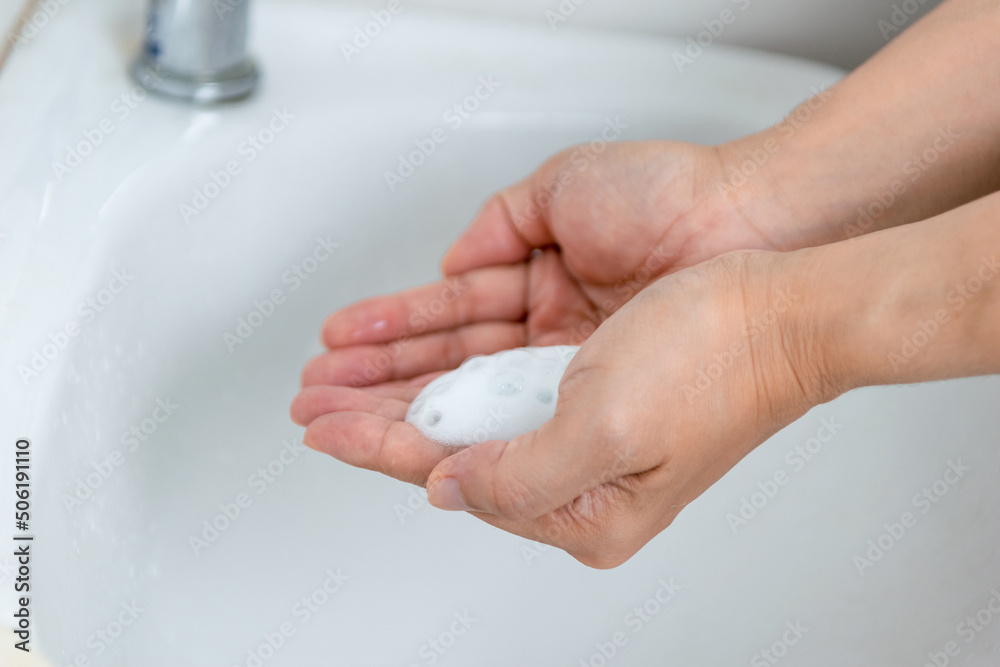 adults wash their hands with hand soap to prevent infection and viruses adults wash their hands with hand soap to prevent infection and viruses