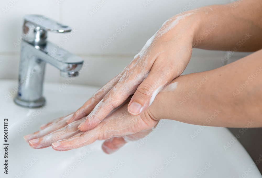 adults wash their hands with hand soap to prevent infection and viruses adults wash their hands with hand soap to prevent infection and viruses