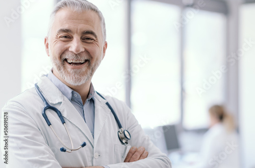 Confident doctor posing with arms crossed