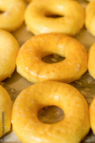 Tasty donuts with jam on wooden background - Hanukkah celebration concept photo