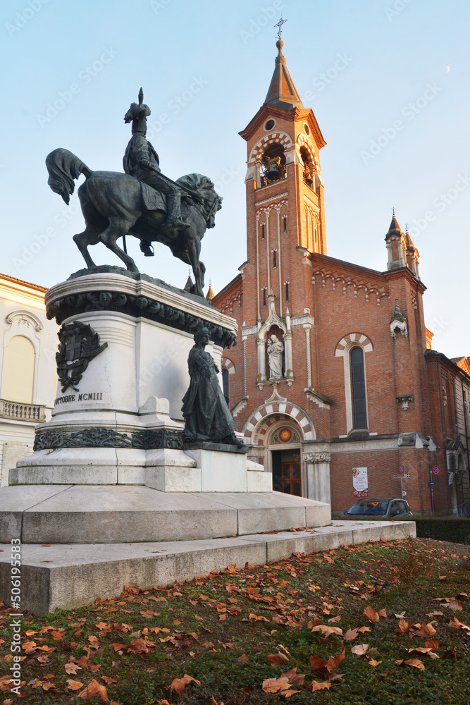 Asti, Piedmont, Italy - The equestrian monument of Umberto I of Savoy and church of Saint Joseph on background