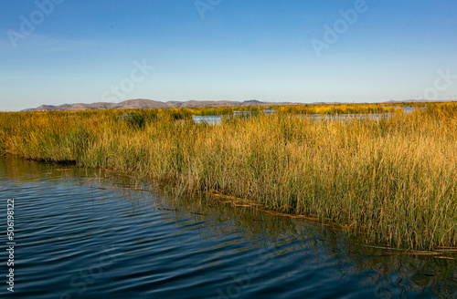 The floating village of Uros on Lake Titicaca, Peru. Lake Titicaca is the largest lake in South America and the highest navigable lake in the world.