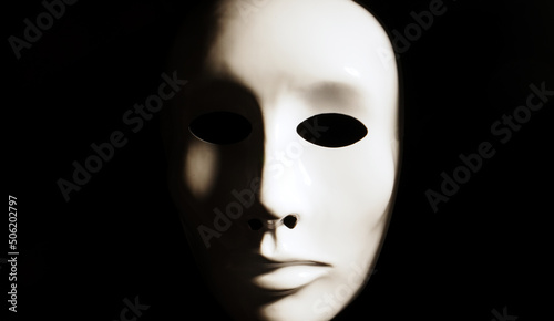 Tela White face mask on dark background.