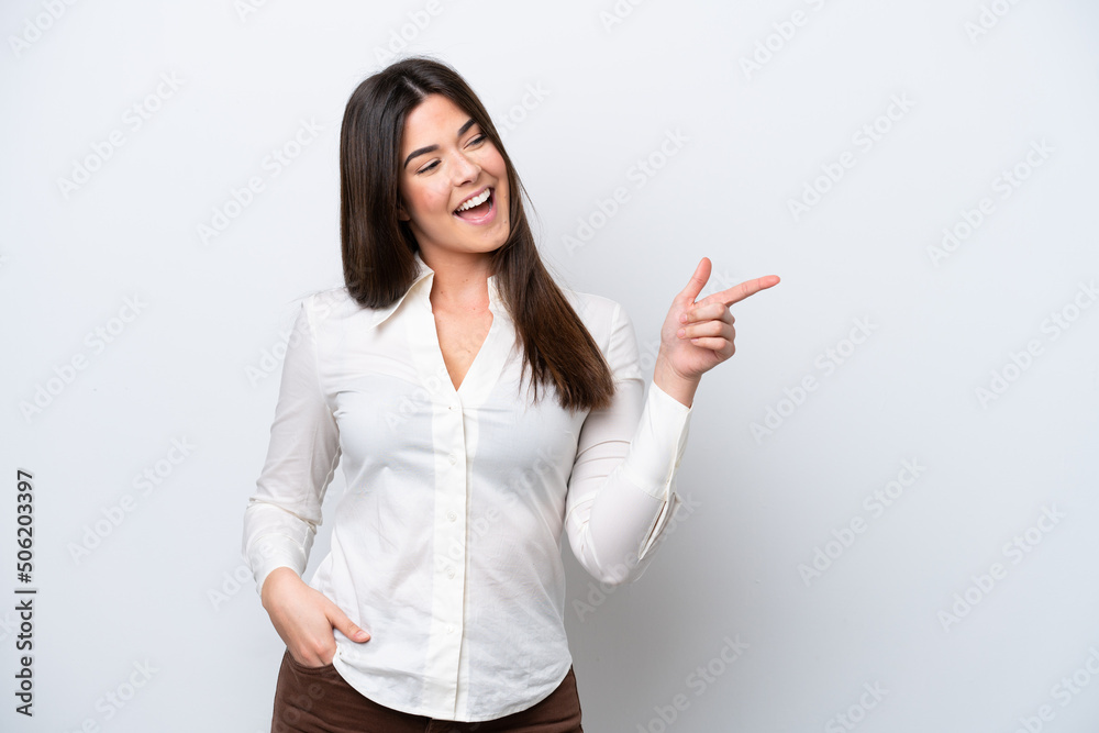 Young Brazilian woman isolated on white background pointing finger to the side and presenting a product Young Brazilian woman isolated on white background pointing finger to the side and presenting a product