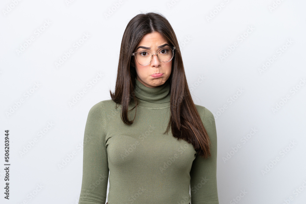 Young Brazilian woman isolated on white background with sad expression Young Brazilian woman isolated on white background with sad expression