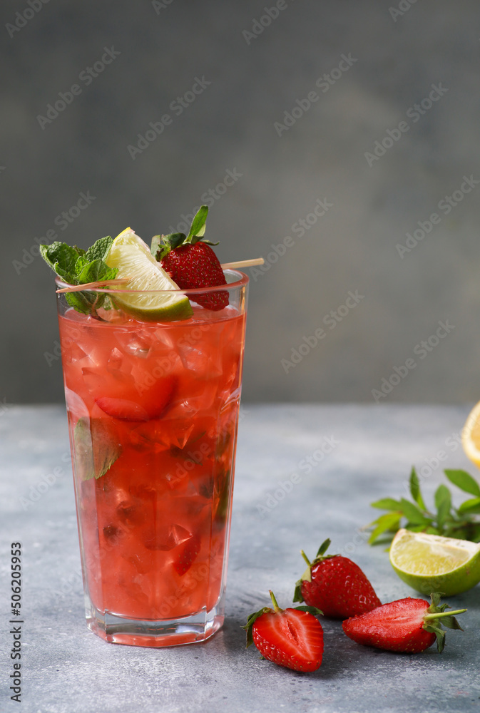 Summer. Drinks and cocktails. Strawberry mojito with ice and mint, lime on a light gray background. Background image, copy space Summer. Drinks and cocktails. Strawberry mojito with ice and mint, lime on a light gray background. Background image, copy space