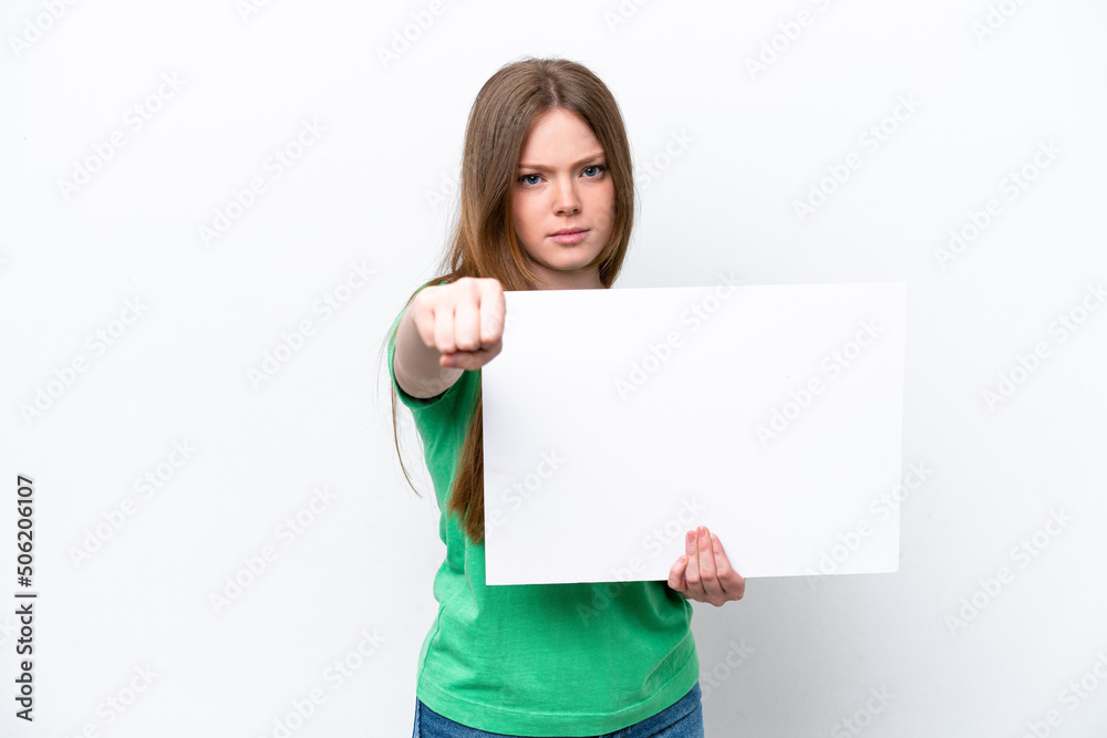 Young caucasian woman isolated on white background holding an empty placard and pointing to the front Young caucasian woman isolated on white background holding an empty placard and pointing to the front