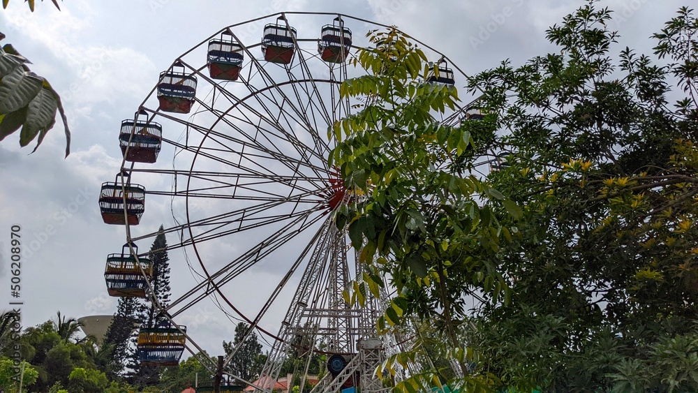 Landscape view of ferris wheel at an amusement park in Bengaluru Landscape view of ferris wheel at an amusement park in Bengaluru