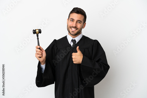 Judge caucasian man isolated on white background giving a thumbs up gesture