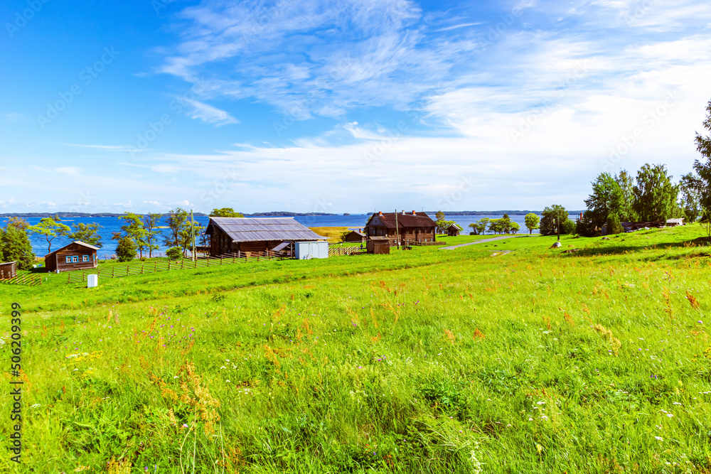 Green grass field and blue sky. Bright sunny summer day. Green grass field and blue sky. Bright sunny summer day.