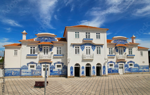 Historic building of old Aveiro Railway station ornamented with typical blue azulejos tile exterior, which tells a story of life in traditional Portugal. Aveiro, Portugal. photo