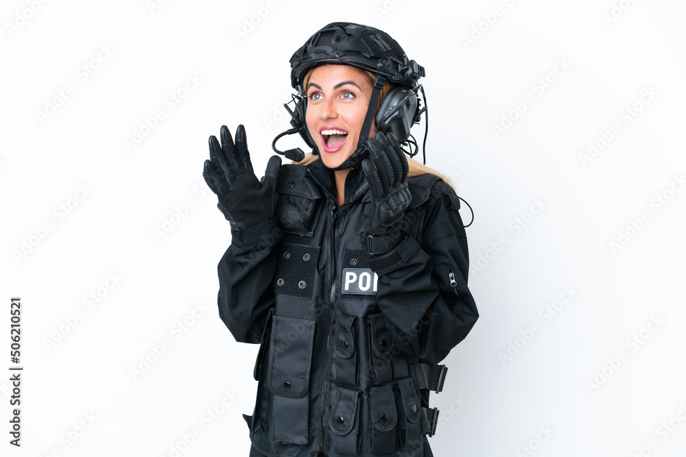 SWAT caucasian woman isolated on white background with surprise facial expression SWAT caucasian woman isolated on white background with surprise facial expression