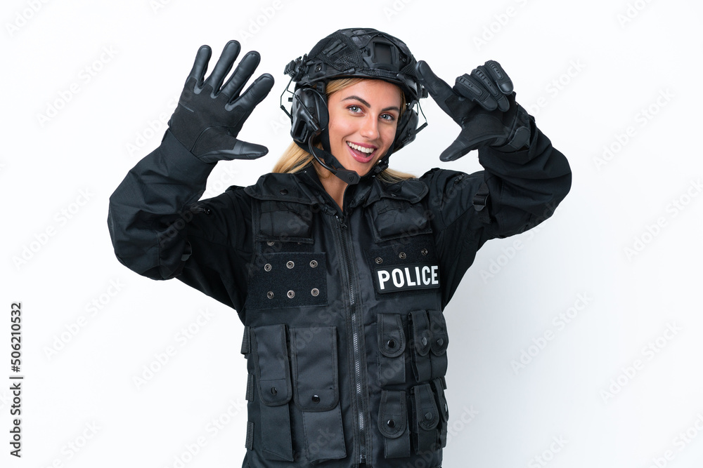 SWAT caucasian woman isolated on white background counting seven with fingers SWAT caucasian woman isolated on white background counting seven with fingers