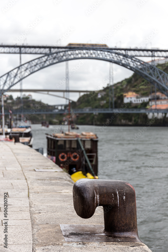 Fototapeta premium Rusty mooring bollard on the Douro river dock in Porto, Portugal