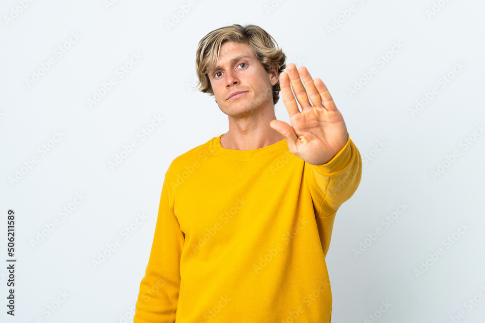 English man over isolated white background making stop gesture English man over isolated white background making stop gesture