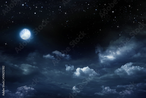 Beautiful dark night sky with clouds and fullmoon and stars