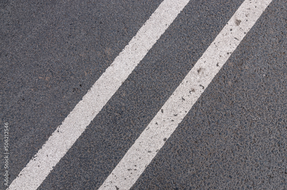 Asphalt texture with double solid line prohibiting overtaking