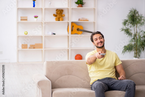 Free Download Young man sitting at home during pandemic - GFXLoad