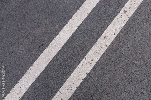 Asphalt texture with double solid line prohibiting overtaking