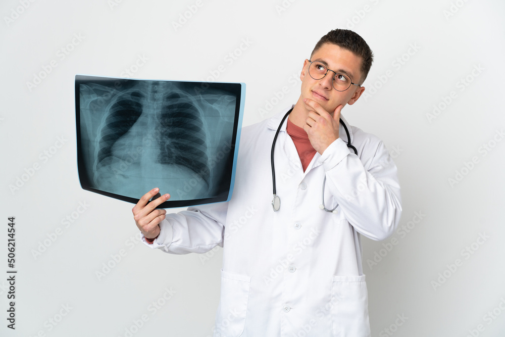 Professional traumatologist on white background having doubts Professional traumatologist on white background having doubts