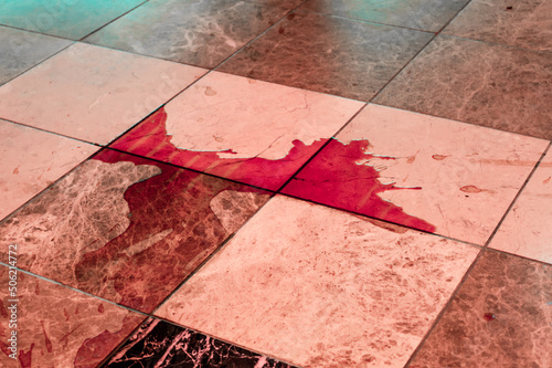 Fototapeta Naklejka Na Ścianę i Meble -  red liquid on the tile floor