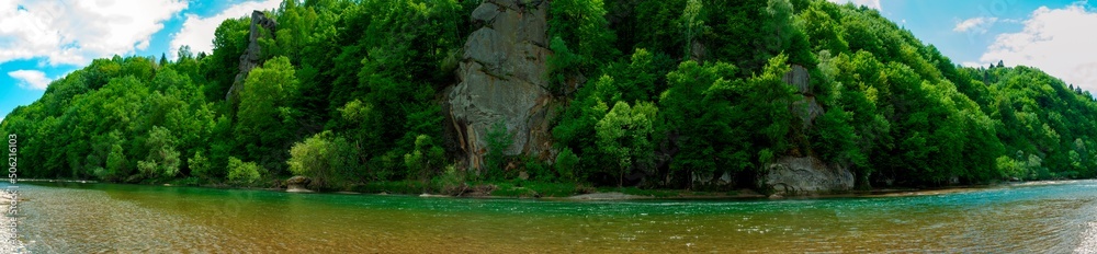Rocks by the river in the mountains, wild and green forest Rocks by the river in the mountains, wild and green forest