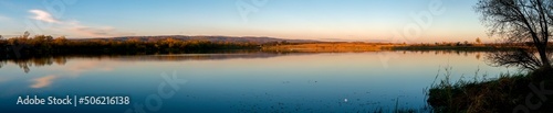 Panorama lake view in sunrise time .Sunrise at the lake