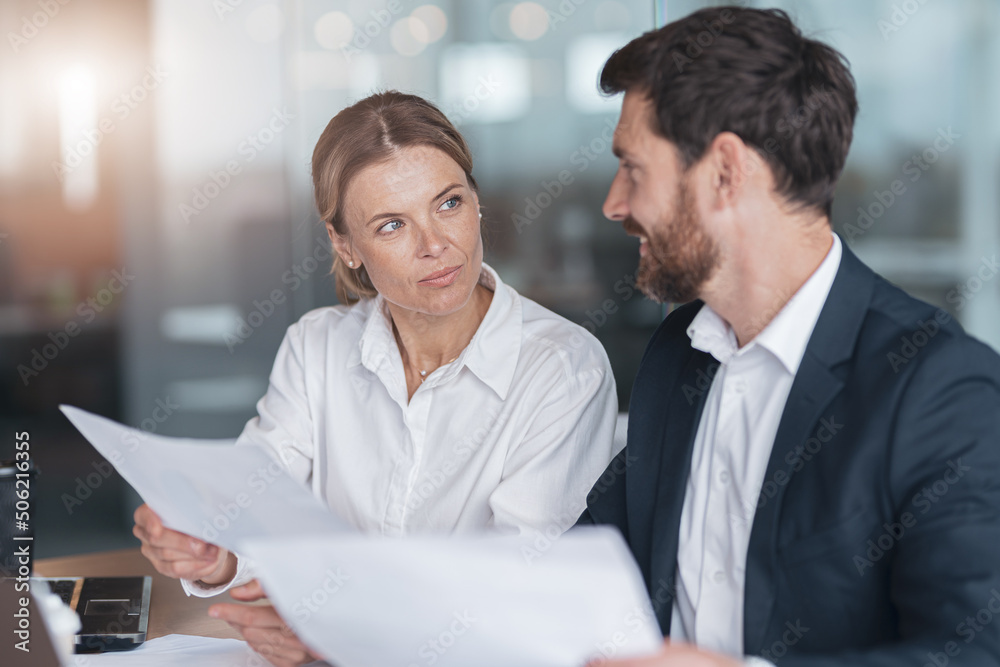 Two business people during work meeting in modern office explaining statistics data to each other Two business people during work meeting in modern office explaining statistics data to each other