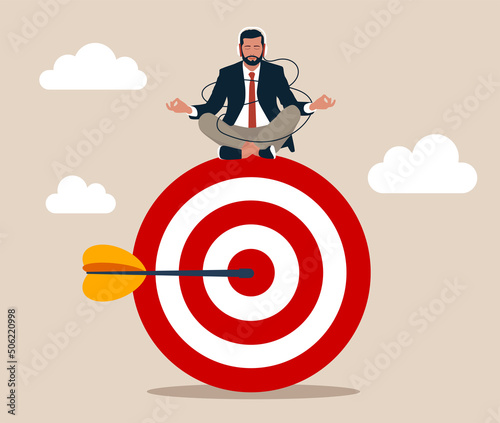 Peaceful businessman meditate sitting and focusing on big archer target. Stay focused and concentrate on business objective, goal or target, relax meditation to eliminate distraction concept.
