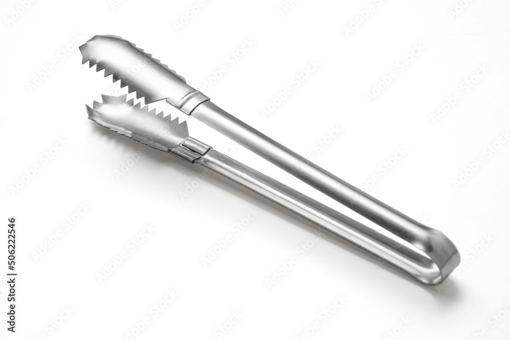 Serving kitchen tongs on white. Serving kitchen tongs on white.