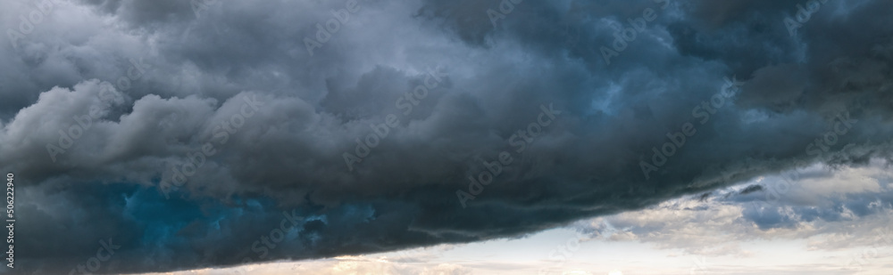 Dramatic cloudy sky with thunderstorm clouds. Natural weather and climate sky panoramic background scene.