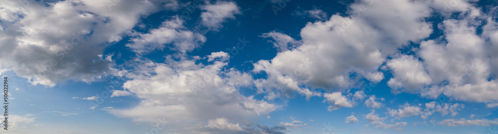 White cumulus clouds in blue sky high resolution background