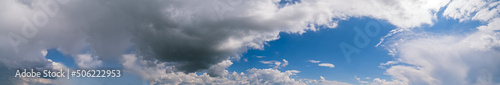 Fuffy clouds in blue sky. Summer good weather skyscape background. photo