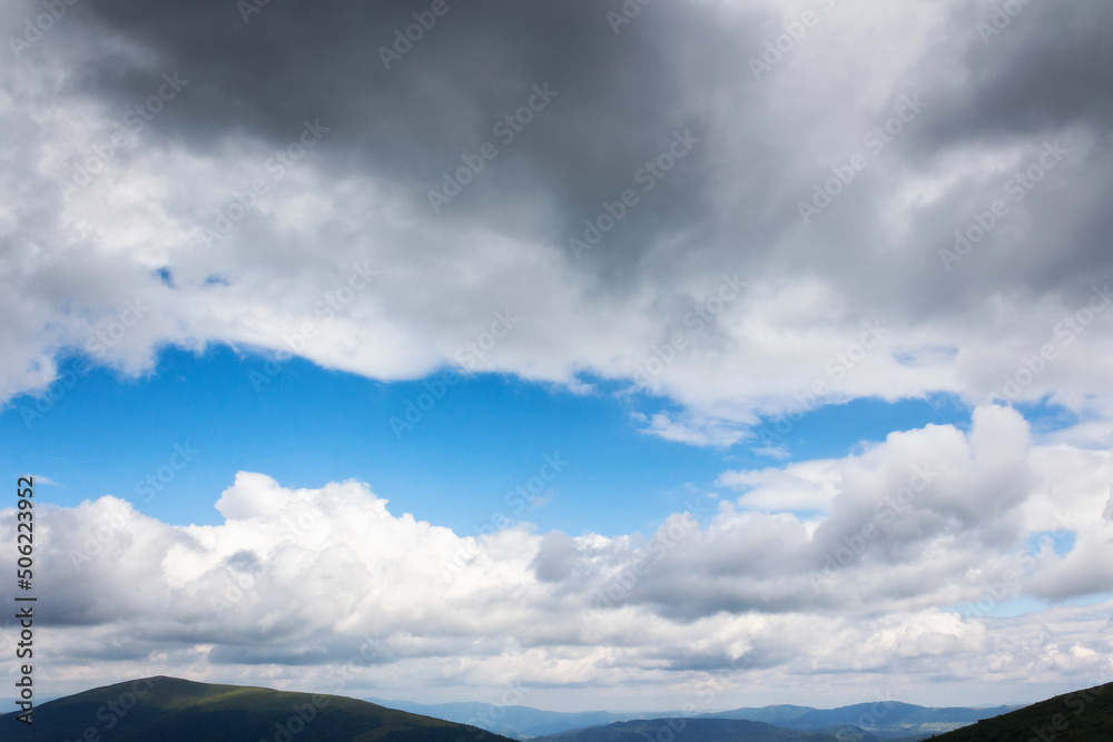 grey clouds on a blue sky. calm nature background. weather change before the rain grey clouds on a blue sky. calm nature background. weather change before the rain