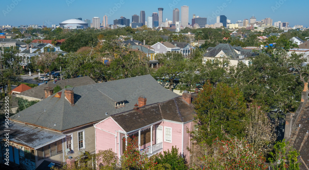 Aerial view of Garden District houses and downtown skyline in New Orleans, Louisiana, USA