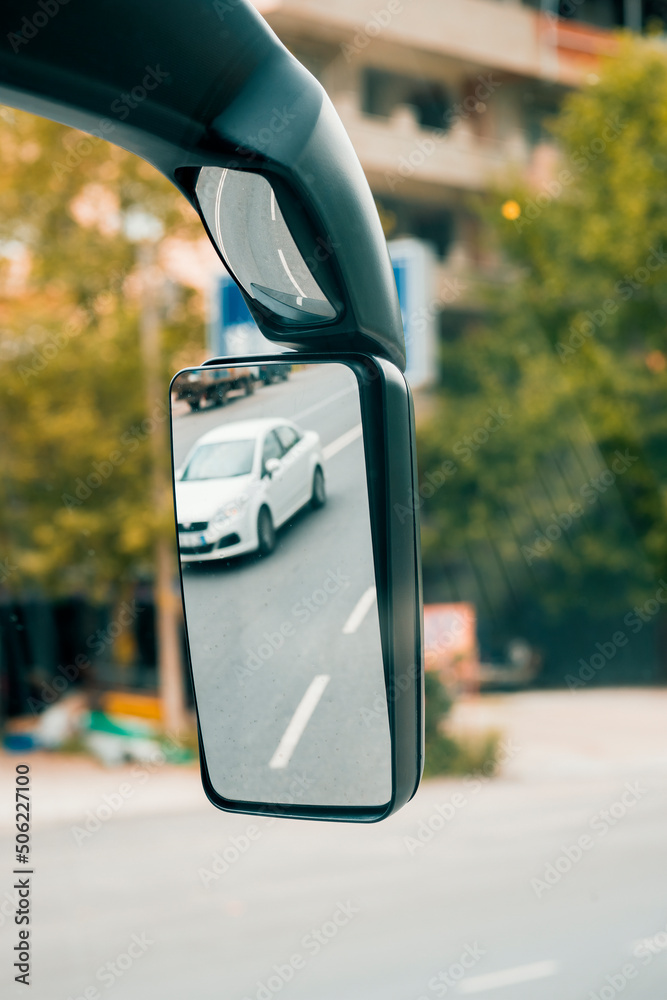 Reflection of a car on the side mirror of intercity coach bus. Reflection of a car on the side mirror of intercity coach bus.