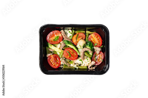Healthy meal, container with beef salad. A set of food for keto diet in a plastic container isolated on white. Top view