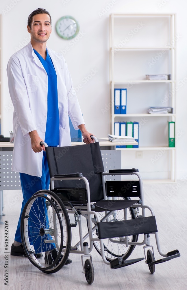 Young male doctor working in the clinic Young male doctor working in the clinic