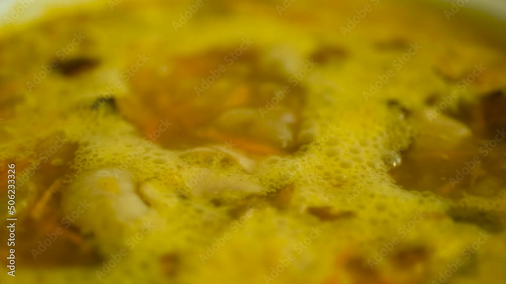 Boiling mushroom soup close-up with carrots, potatoes vermicelli. Boiling mushroom soup close-up with carrots, potatoes vermicelli.