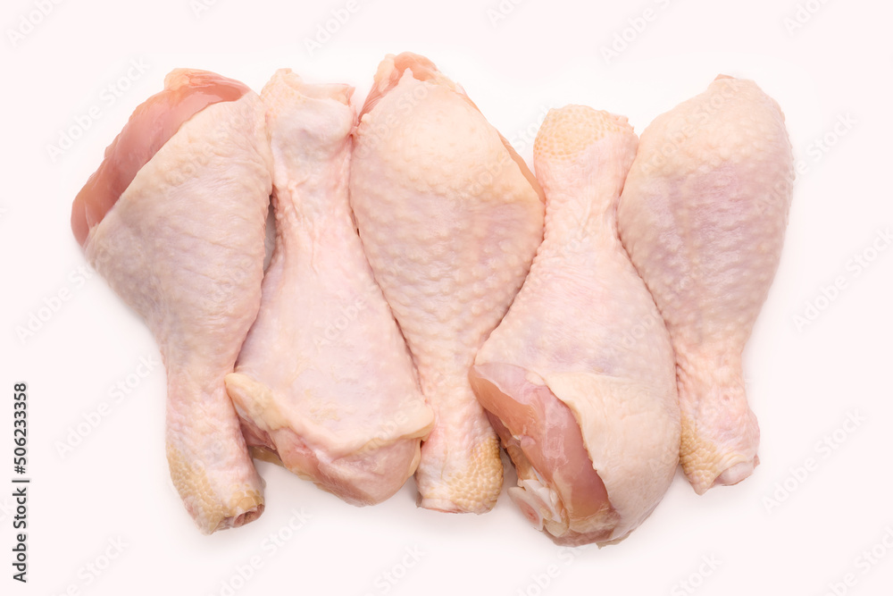 Raw chicken legs on white background isolated. Chicken meat. Diet meat. Raw chicken legs on white background isolated. Chicken meat. Diet meat.