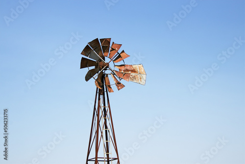 old windmill on sky background