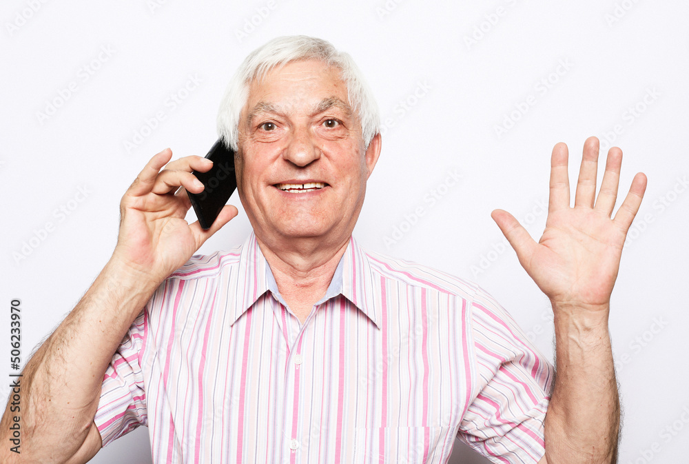 close up of happy old man using smartphone over white background. close up of happy old man using smartphone over white background.