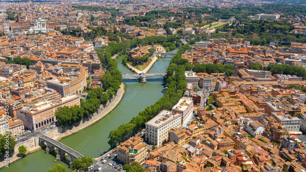 Aerial view of Trastevere district and Tiber Island, the only river island in the part of the Tiber which runs through Rome, Italy. In the period of ancient Rome, the temple of Asclepius stood here