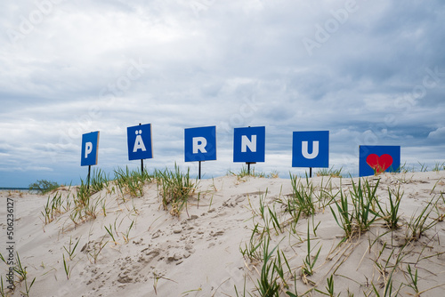 Pärnu sign on sand dunes at Pärnu beach. Viewpoint with Pärnu sign. photo