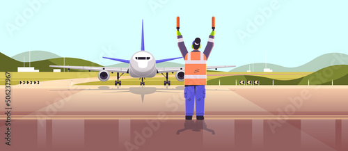 aviation marshaller supervisor in uniform navigate with light sticks air traffic controller airline worker in signal vest