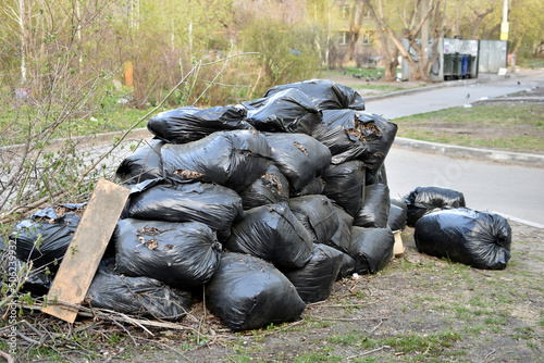 Black garbage bags after street cleaning